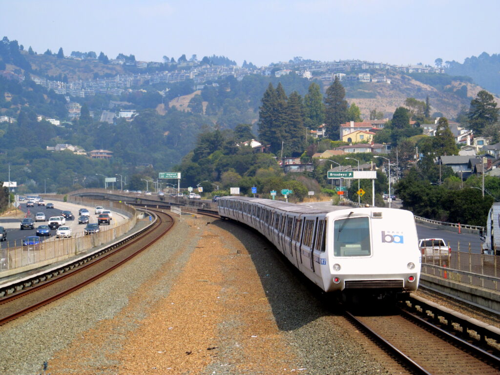A BART train arriving at a Bay Area station platform